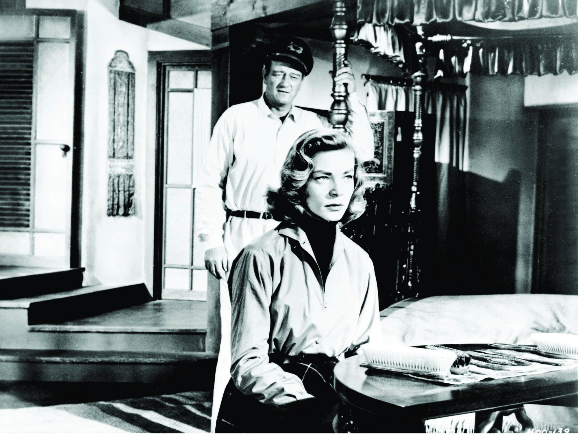 Still of Lauren Bacall and John Wayne in Blood Alley (1955)