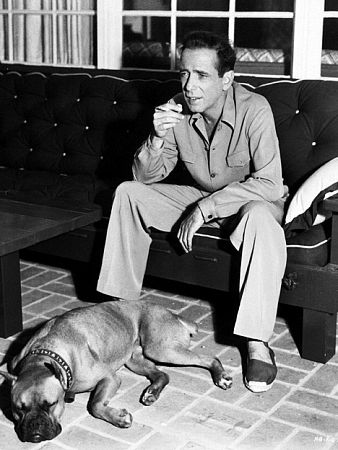 With his pet boxer at home, circa 1949.