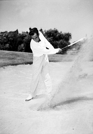Playing golf, circa 1949.