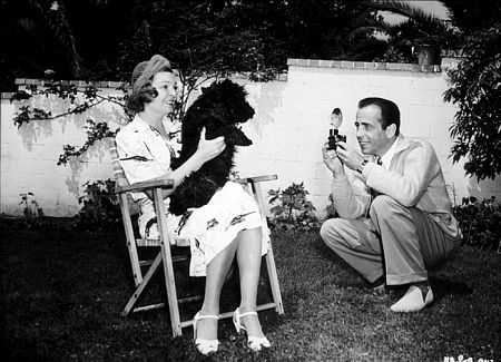 Humphrey Bogart and his third wife, Mayo Methot, with their dog, circa 1944.