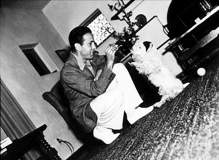 With his dog at home, circa 1936.