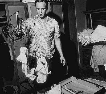 Marlon Brando cleaning up his Beverly Glen home in Los Angeles
