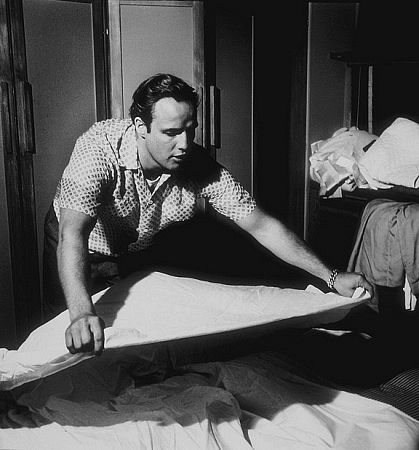 Marlon Brando cleaning up his Beverly Glen home, Los Angeles