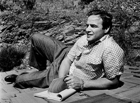 Marlon Brando studying a script