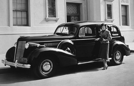 Olivia DeHavilland with her 1937 Buick C. 1937 *M.W.*
