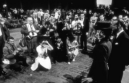 33-2331 Audrey Hepburn greets press photographers on the set of 