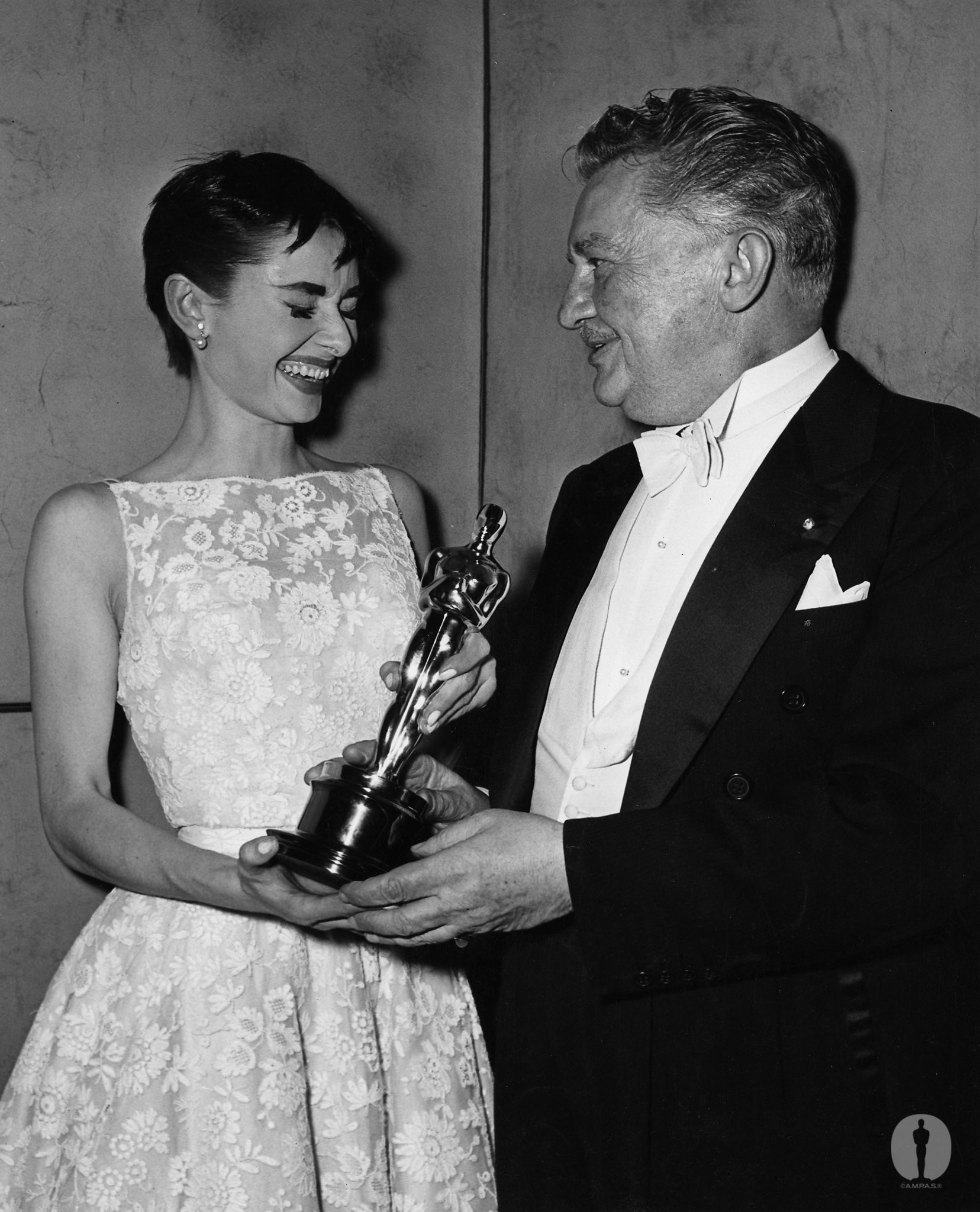 Best Actress Audrey Hepburn (Roman Holiday) with Jean Hersholt at the 26th Academy Awards.