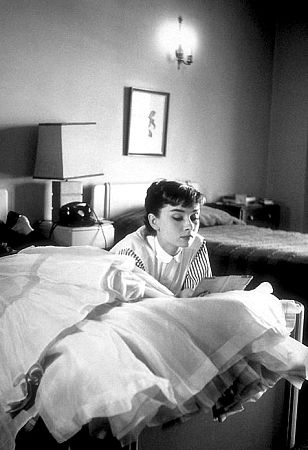 33-2338 Audrey Hepburn rests in her hotel room (Chapman Park) after a photo shoot at Paramount