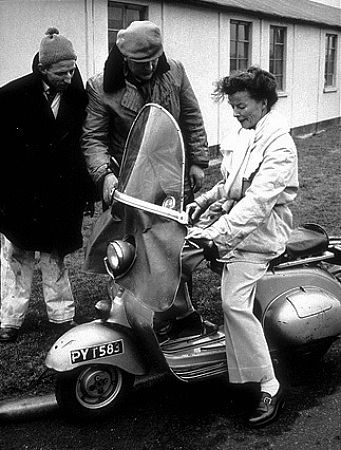 722-1112 Katharine Hepburn with wardrobe man Johnny Hilling on the set of 