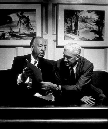 Alfred Hitchcock with writer Pete Martin in his office at Universal Studios, 1957.