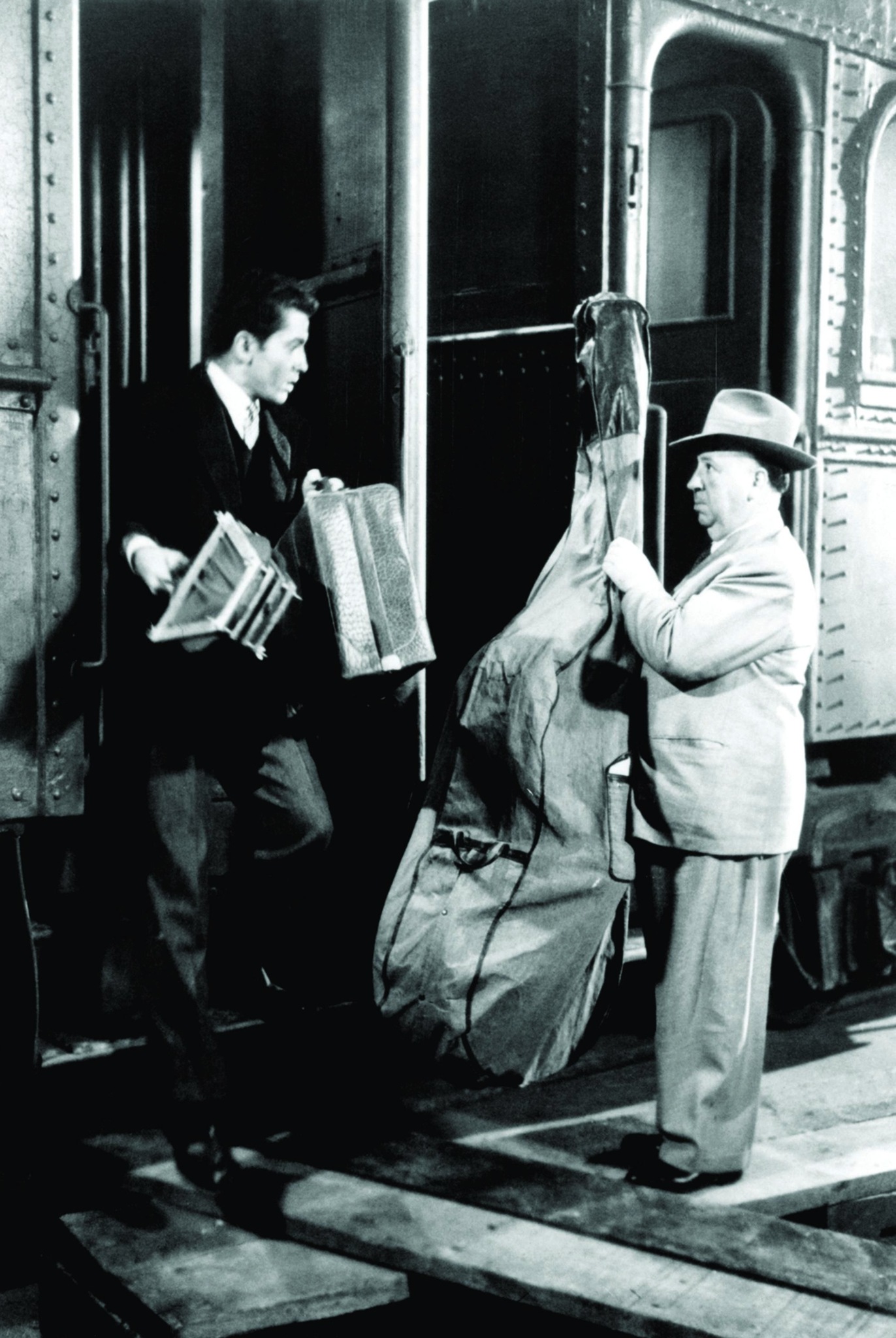 Still of Alfred Hitchcock and Farley Granger in Strangers on a Train (1951)