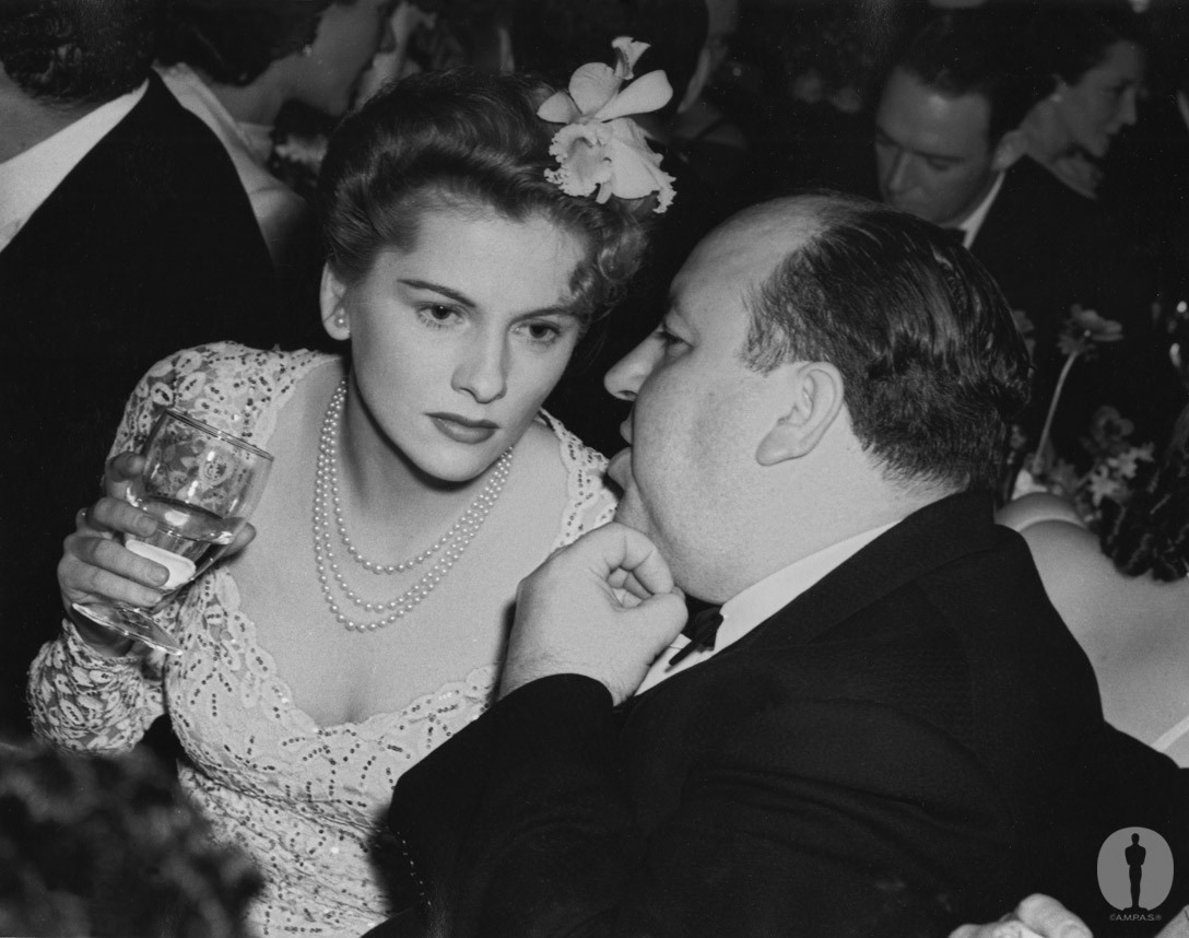 The star and director of Best Picture winner Rebecca, Joan Fontaine and Alfred Hitchcock, at the 13th Academy Awards banquet.