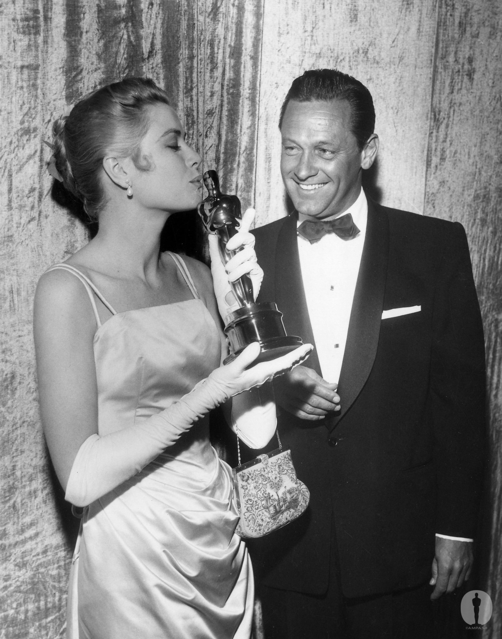 Best Actress Grace Kelly (The Country Girl) with presenter William Holden at the 27th Academy Awards.
