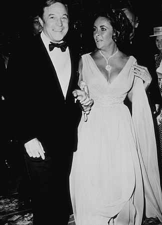 Elizabeth Taylor and Gene Kelley attend the opening of 