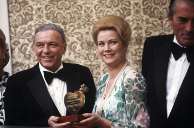 Grace Kelly presenting Humanitarian Award to Frank Sinatra (Gregory Peck on right)