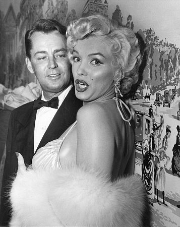 Marilyn Monroe with Alan Ladd after receiving actor & actress awards at the Photoplay Gold Metal Awards dinner, 1954.