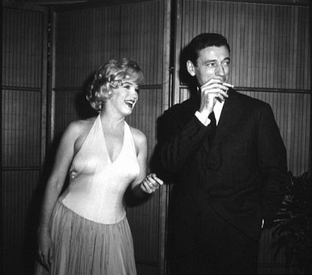 M. Monroe & Yves Montand at a press party for 