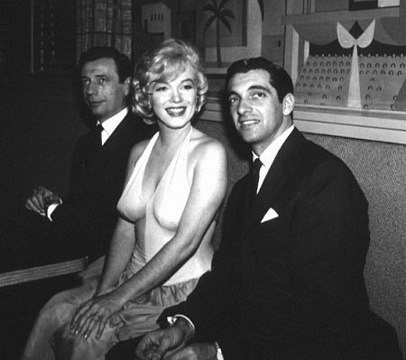 M. Monroe & Yves Montand at a party for 