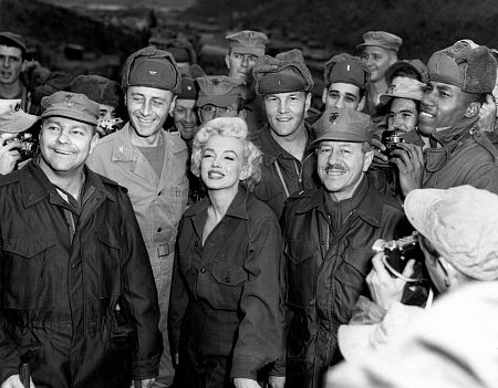 Marilyn Monroe with Gen. R. Hogaldoom and Col. W.K. Jones after a show give for more than 10,000 Marines, 1954.
