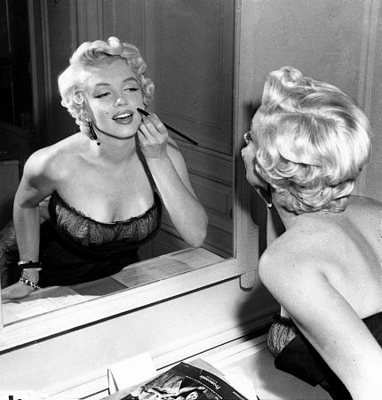 Marilyn Monroe in a New York Apartment getting made-up for her balcony scene in 