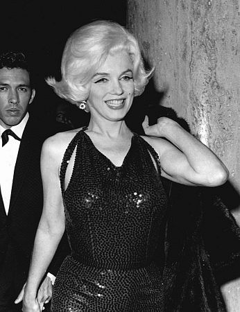 Marilyn Monroe with Mexican writer Jose Bolaños at a Hollywood Party, March 1962.
