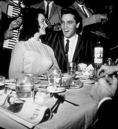 Elvis Presley with a friend at the Moulin Rouge in Hollywood, circa 1964.