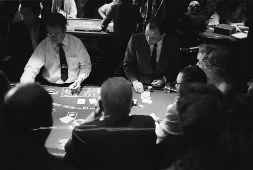 Frank Sinatra at the Sands Hotel in Las Vegas deals cards at the Blackjack table