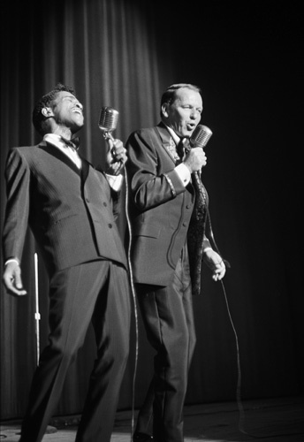 Frank Sinatra and Sammy Davis Jr. performing at a Share Party circa 1963