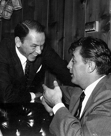 Frank Sinatra and Robert Mitchum at Sinatra's 42nd birthday party held at the Villa Capri, 1957. Vintage silver gelatin, 9.5x7.5, signed. $800 © 1978 Joe Shere MPTV