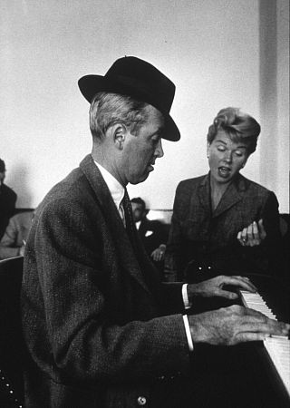 James Stewart and Doris Day at the piano on the set of 