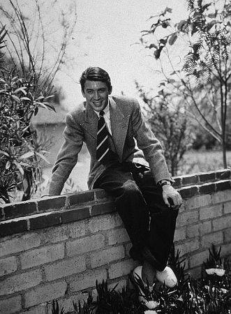 James Stewart sitting on a brick wall, 1936. Vintage silver gelatin, 12.75x9.75, matted on 18.5x15.5 board, signed. $1200 © 1978 Ted Allan MPTV