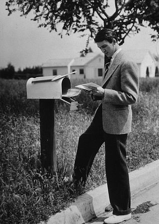 James Stewart standing next to a mailbox, 1936. Vintage silver gelatin, 13x10, estate stamped. $1200 © 1978 Ted Allan MPTV