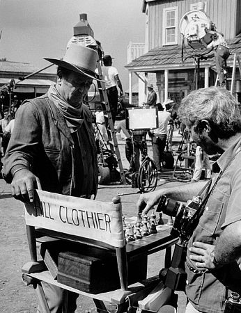 John Wayne and photographer, David Sutton, playing chess on the set of 