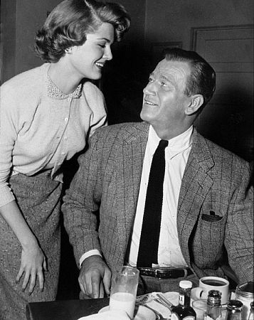 John Wayne and Pat Blake in the Green Room at Warner Bros. Studios, 1955.