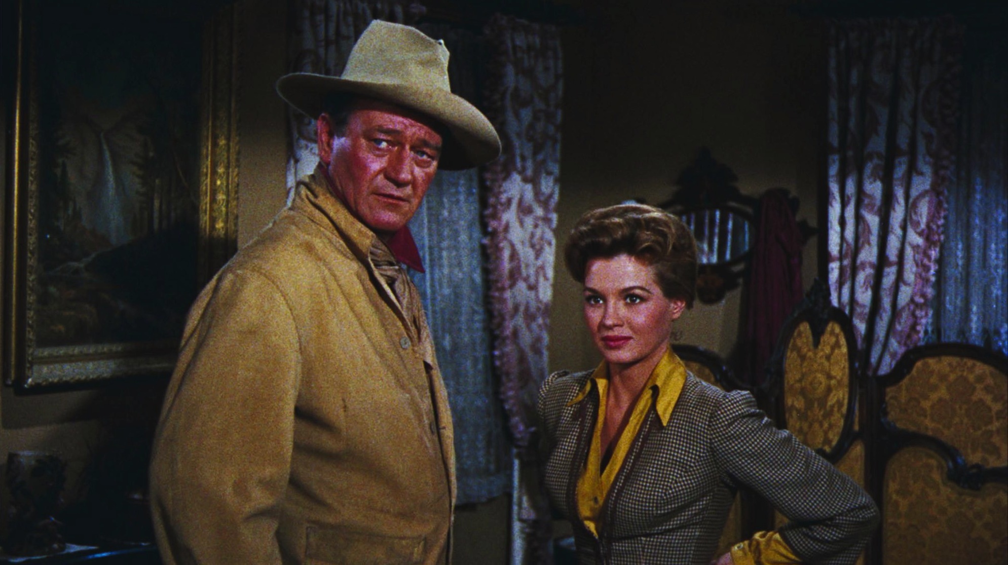 Still of John Wayne and Angie Dickinson in Rio Bravo (1959)