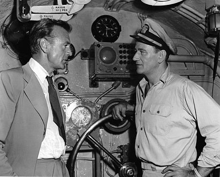 Gary Cooper visiting John Wayne on the set of 