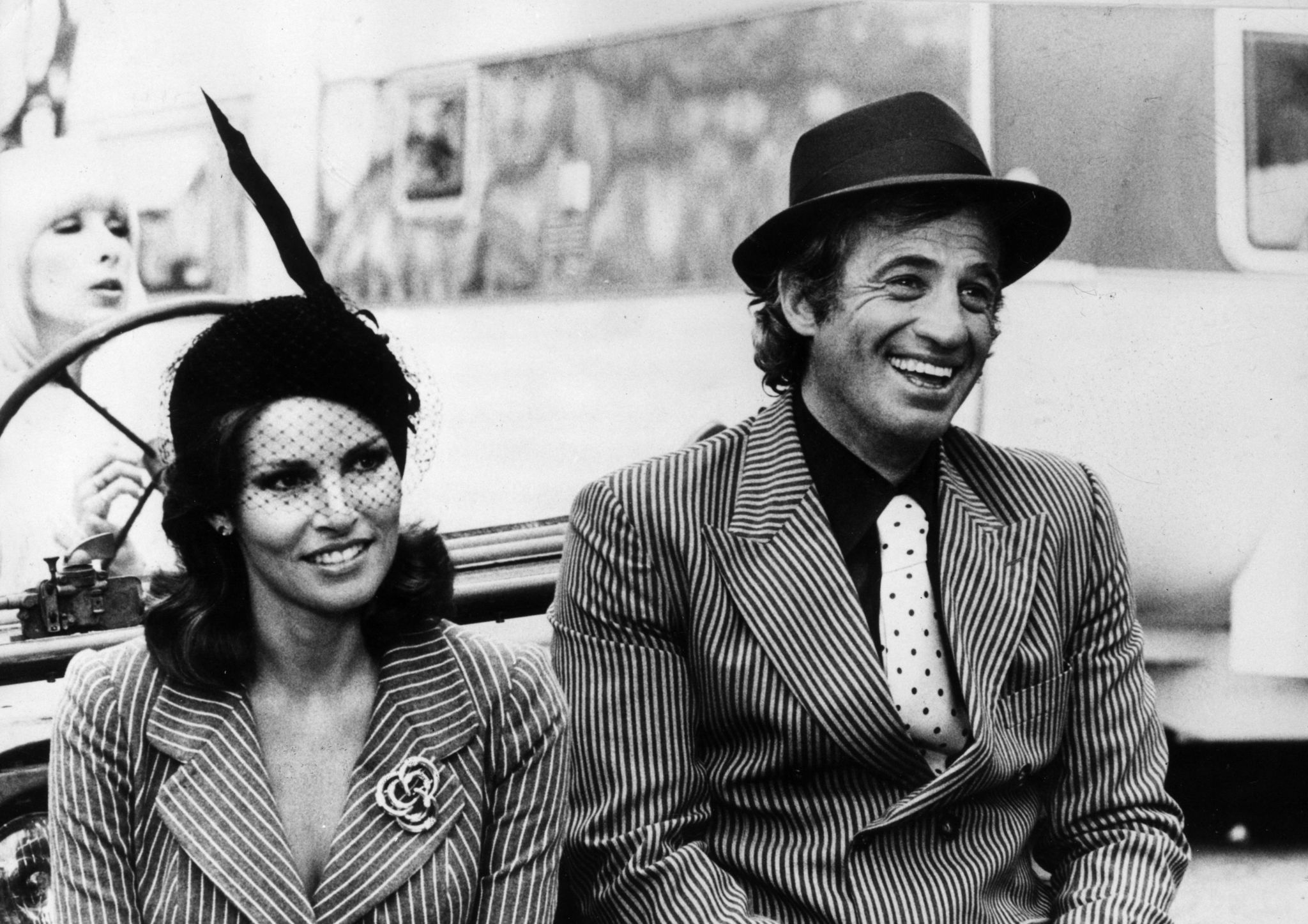 3rd October 1977: French film actor Jean-Paul Belmondo with actress Raquel Welch.