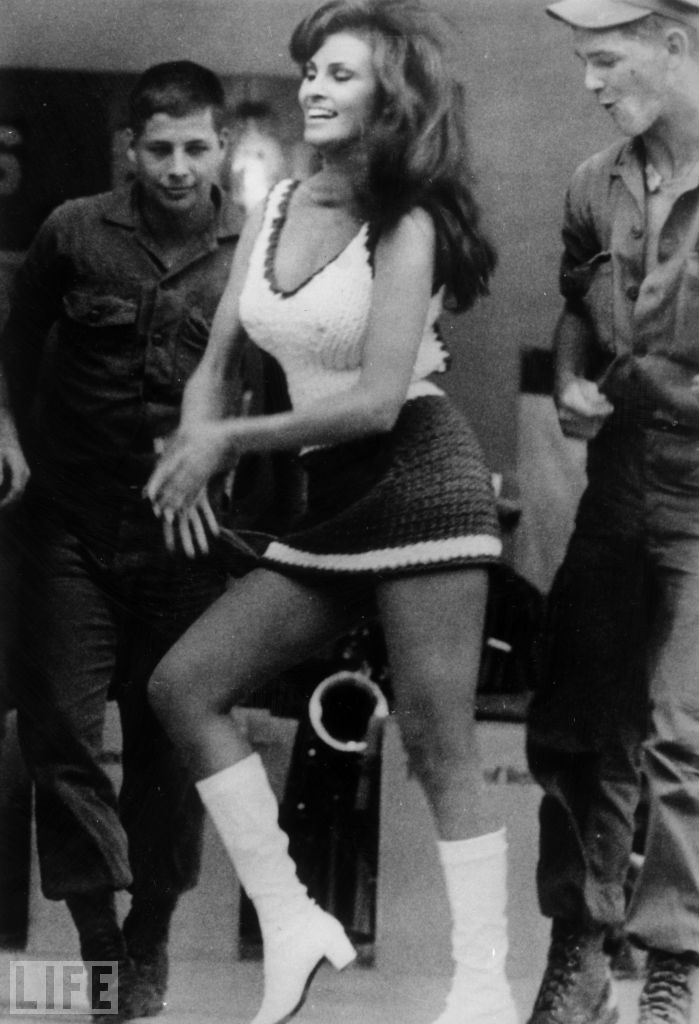 Two soldiers admire Raquel Welch's um, moves, etc., during a visit to Vietnam on Jan. 9, 1968.