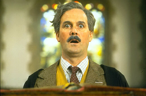 Still of John Cleese in The Meaning of Life (1983)