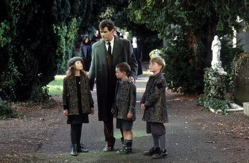 Desmond Doyle (PIERCE BROSNAN) talks to his children (left to right) Evelyn (SOPHIE VAVASSEUR), Dermot (NIALL BEAGAN), and Maurice (HUGH MacDONAGH)