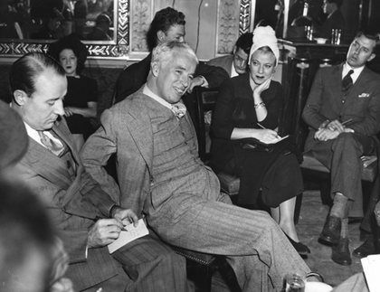 Charlie Chaplin at a press conference for the premiere of 