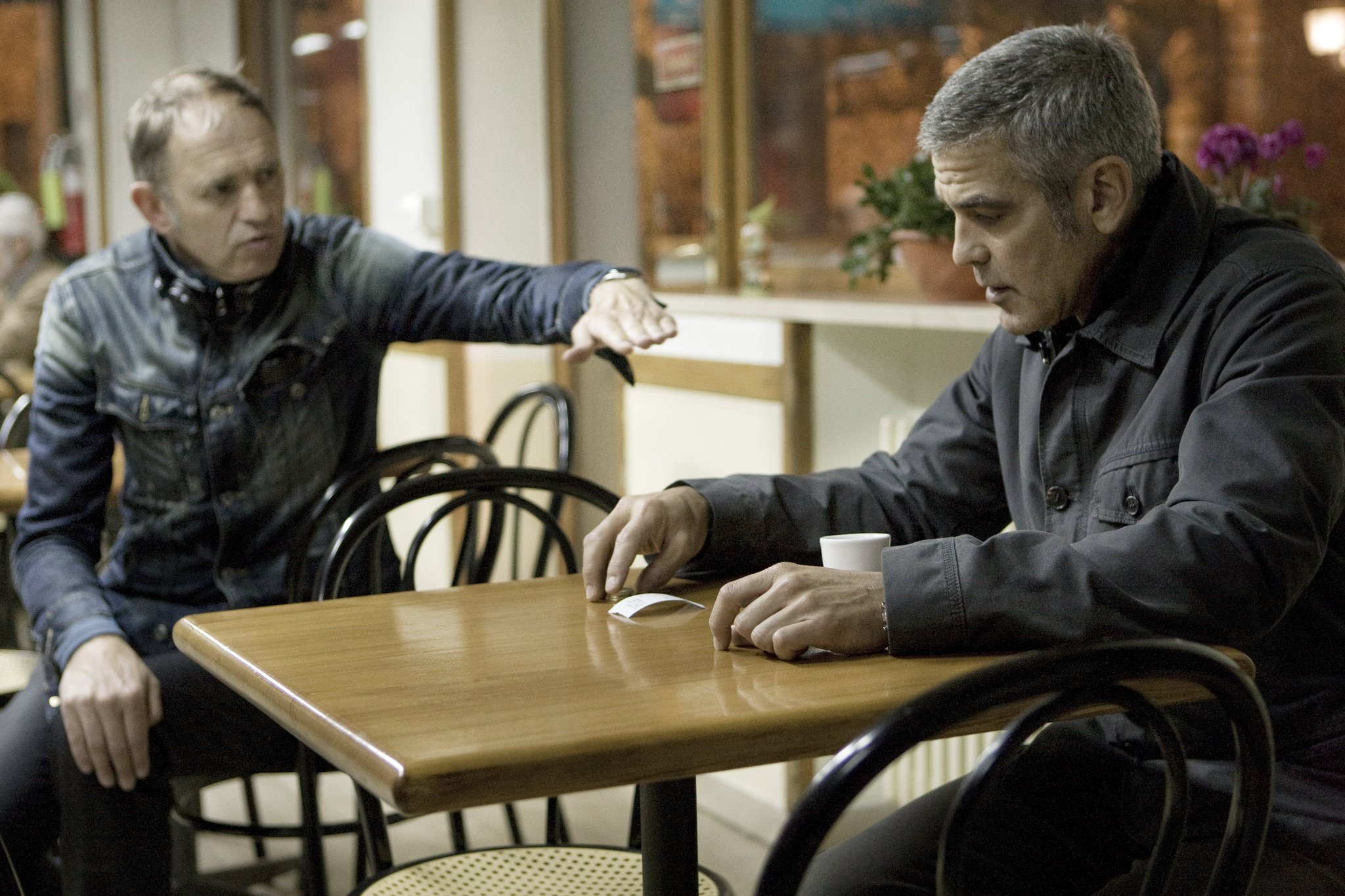 Still of George Clooney and Anton Corbijn in The American (2010)