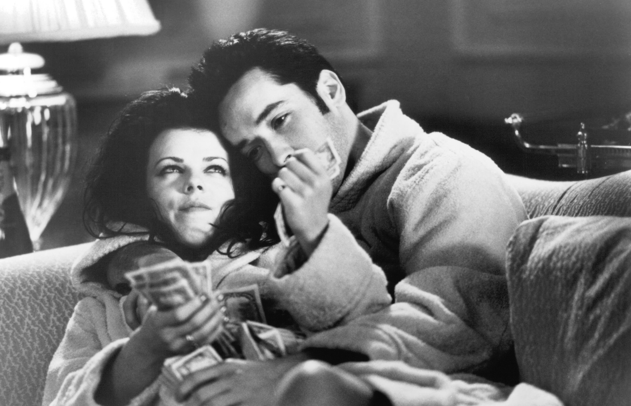 Still of John Cusack and Debi Mazar in Money for Nothing (1993)