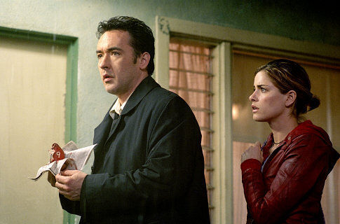 Still of John Cusack and Amanda Peet in Identity (2003)