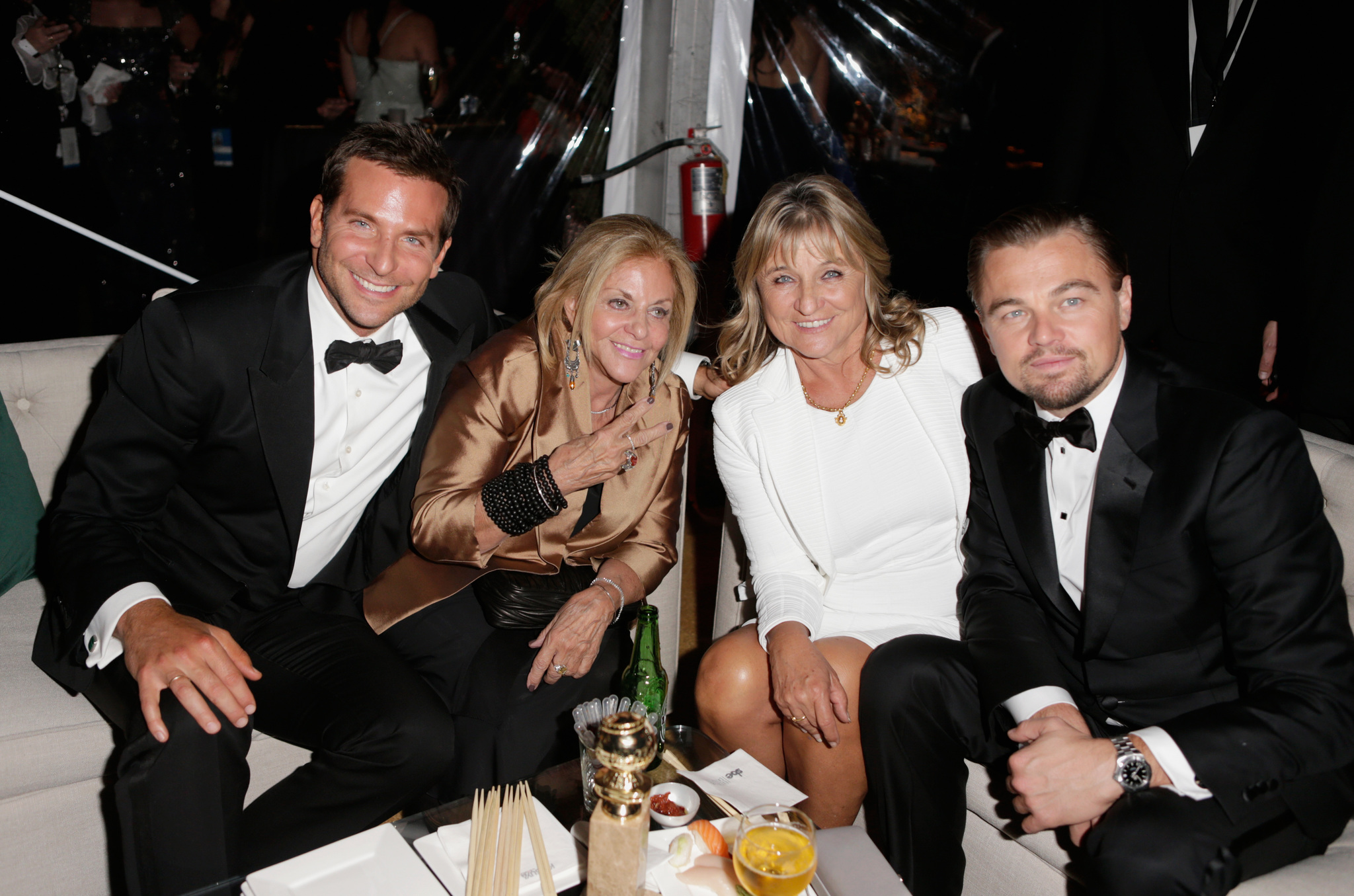Actor Bradley Cooper, mother Gloria Campano, (R) Actor Leonardo DiCaprio, and (2nd-R) mother Irmelin Indenbirken attend The Weinstein Company & Netflix's 2014 Golden Globes After Party