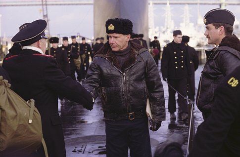(Center) Harrison Ford as Alexei Vostrikov and (right) Steve Nicolson as Demichev