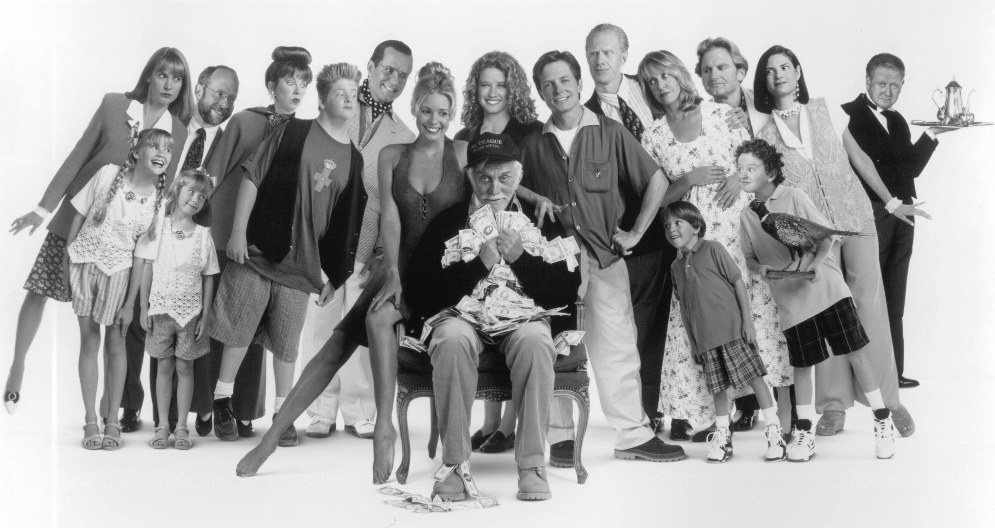 Still of Kirk Douglas, Michael J. Fox, Bob Balaban, Ed Begley Jr., Nancy Travis, Olivia d'Abo, Jere Burns, Colleen Camp, Siobhan Fallon, Phil Hartman, Joyce Hyser and Mary Ellen Trainor in Greedy (1994)