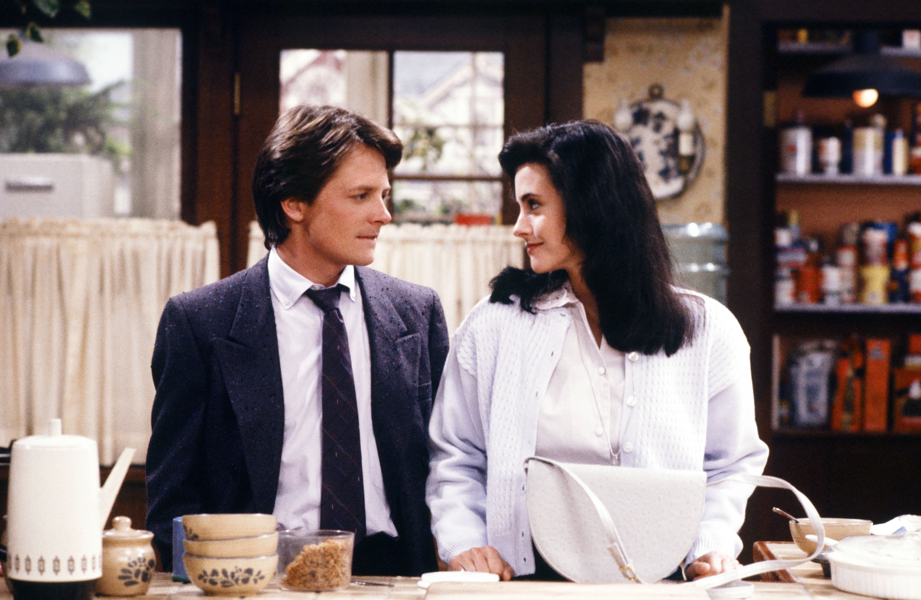 Still of Michael J. Fox and Courteney Cox in Family Ties (1982)