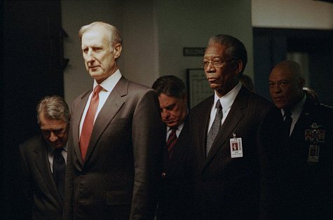 (Foreground, left to right) James Cromwell as President Fowler and Morgan Freeman as DCI William Cabot, (background, left to right) Philip Baker Hall as Defense Secretary Becker, Bruce McGill as National Security Advisor Revell and John Beasley as General Lasseter in 