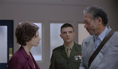 Grimes (MORGAN FREEMAN) cautions the defiant Claire (ASHLEY JUDD) to play by the military court's rules (a warning Grimes himself often ignores), as Embry (ADAM SCOTT) looks on.